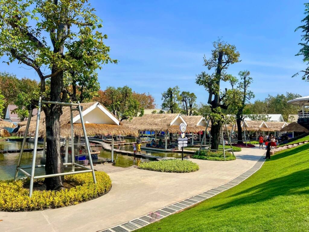 Beautiful outdoor seating area with trees, pathways, and cozy cafes for a memorable dining experienc.